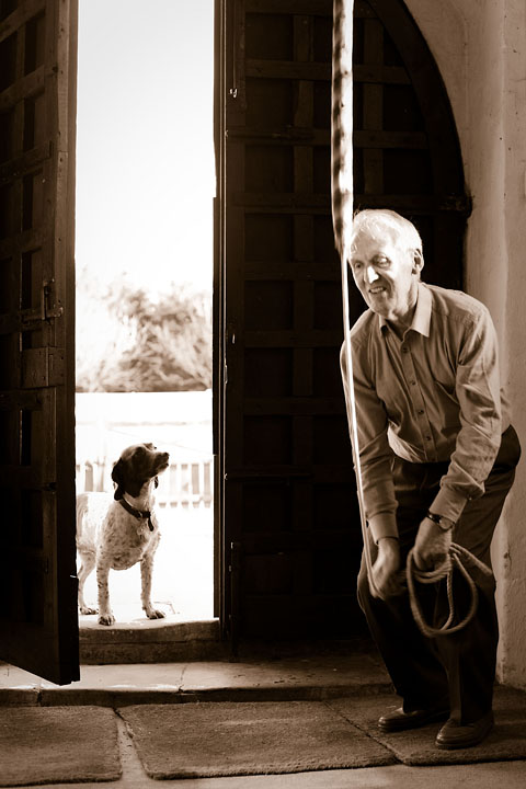 Beadle and his dog ringing the church bell - UK/England - Steventon - April 2012 - England